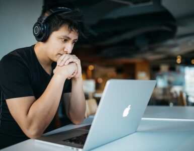 man looking at the laptop screen