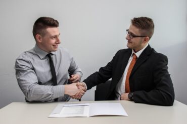 two men shaking hands